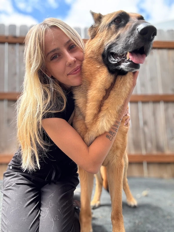 A photo of Mattie with her dog Thomas